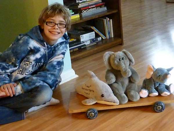 Stuffed animals get a ride on our homemade skateboard