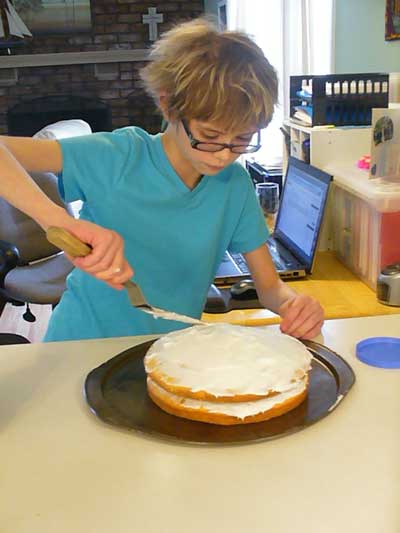 Baking and icing a cake as a homeschool project
