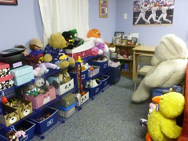 Homeschoolers' finished basement rec room with storage bins