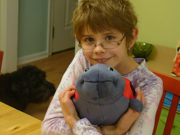 Ashar with a stuffed ladybug he received for his 11th birthday