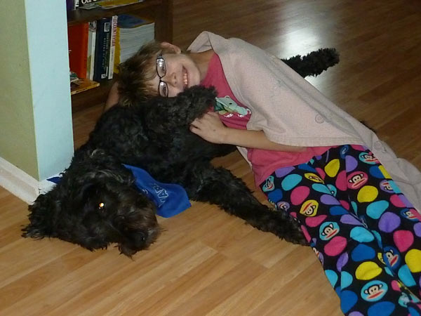 Cuddling the dog during a thunderstorm