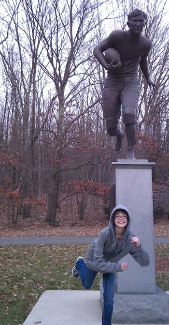 Posing with a statue of Jim Thorpe playing football