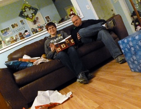 Joan and Chris opening an edible Christmas present