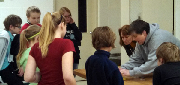 Showing how to give an alpaca an injection using a banana at 4-H