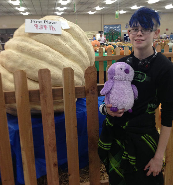 Unschooling in September 2016: One of the contests every year at the York Fair is "Who Can Grow the Giant-est Pumpkin?" This was this year's winner (shown with Ashar and Lilac Pengin.)